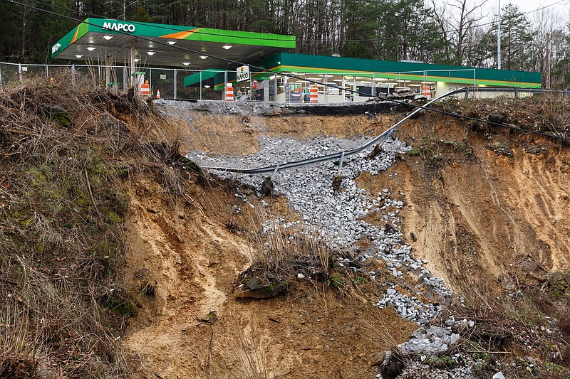 A section of hillside beneath a Mapco gas station slid away after heavy rainfall, seen on Wednesday, Feb. 20, 2019, in Wildwood, Ga. Continuous rain through the week has raised area waterways to flood stages, with more rain expected in the coming days.