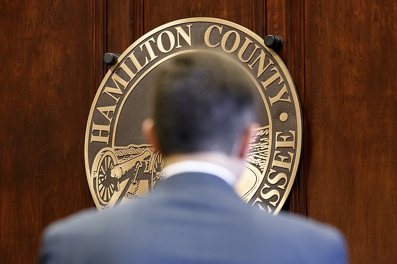 The Hamilton County seal is seen on the wall behind Jeffrey Davis as he interviews for General Sessions Judge before members of the Hamilton County Commission in the County Commission assembly room at the Hamilton County Courthouse on Wednesday, March 20, 2019 in Chattanooga, Tenn. Current General Sessions Court Judge Clarence Shattuck, 83, announced he will retire on April 1.