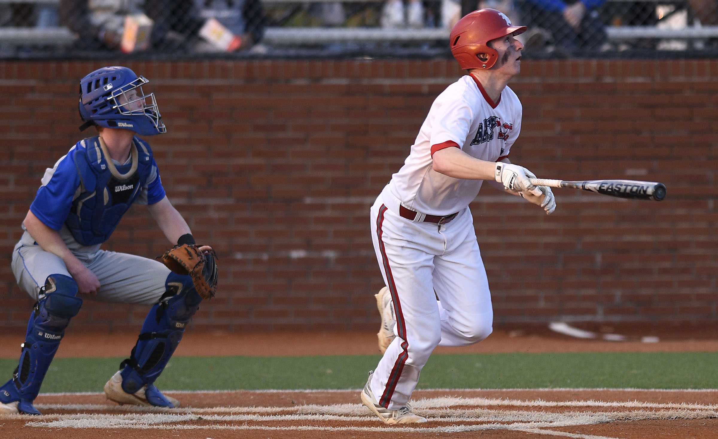 Baylor batter Colin Ahearn and McCallie catcher Carter Edge watch as Ahearn's home run sails over the fence during Wednesday's game at McCallie. Ahearn was one of four Red Raiders who homered in a 10-6 win against the Blue Tornado.