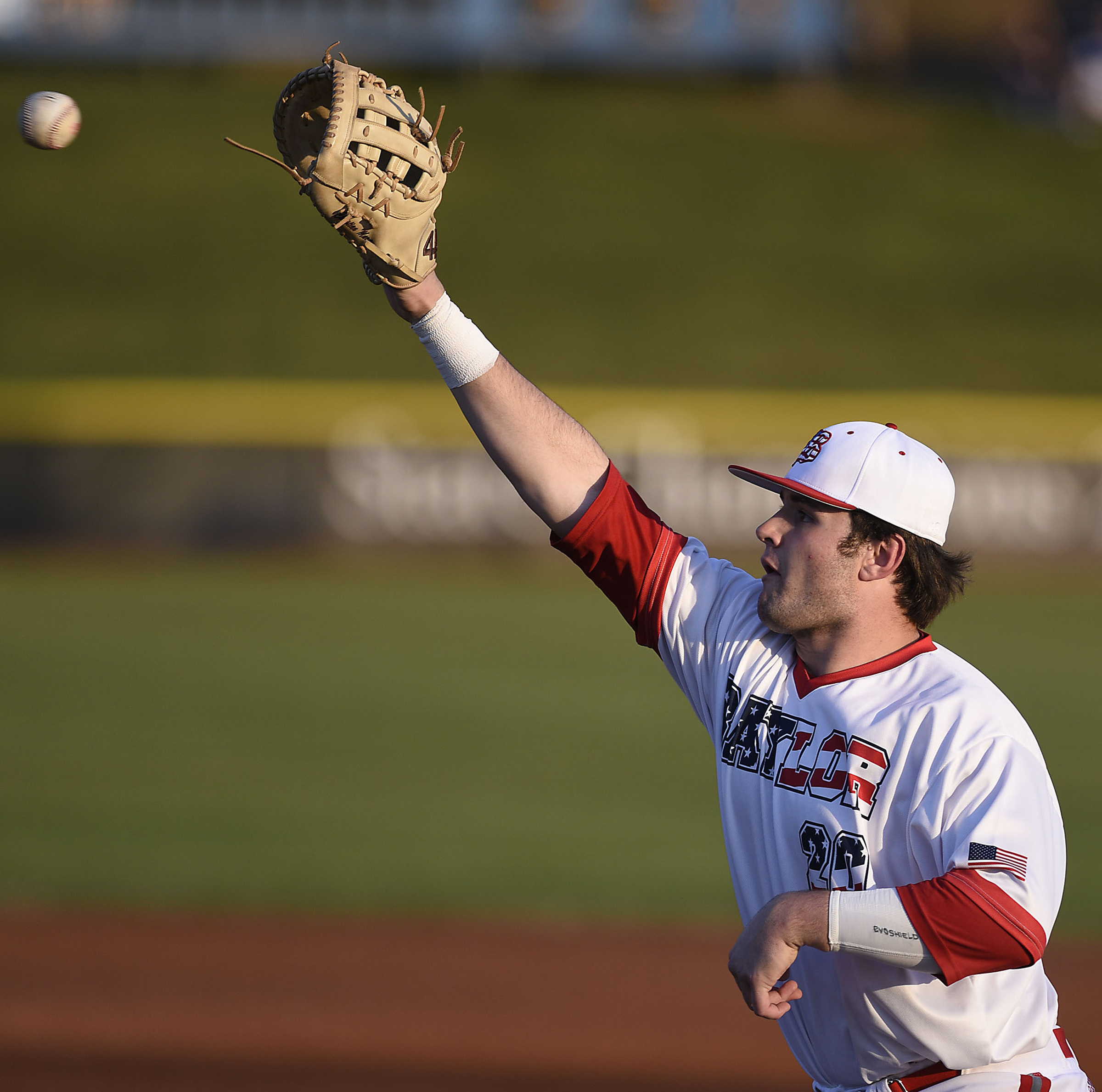 Baylor first baseman Christian Martin (20) tags the throw to put a McCallie runner out. The Baylor Red Raiders visited the McCallie Blue Tornado in TSSAA baseball action on March 20, 2019.