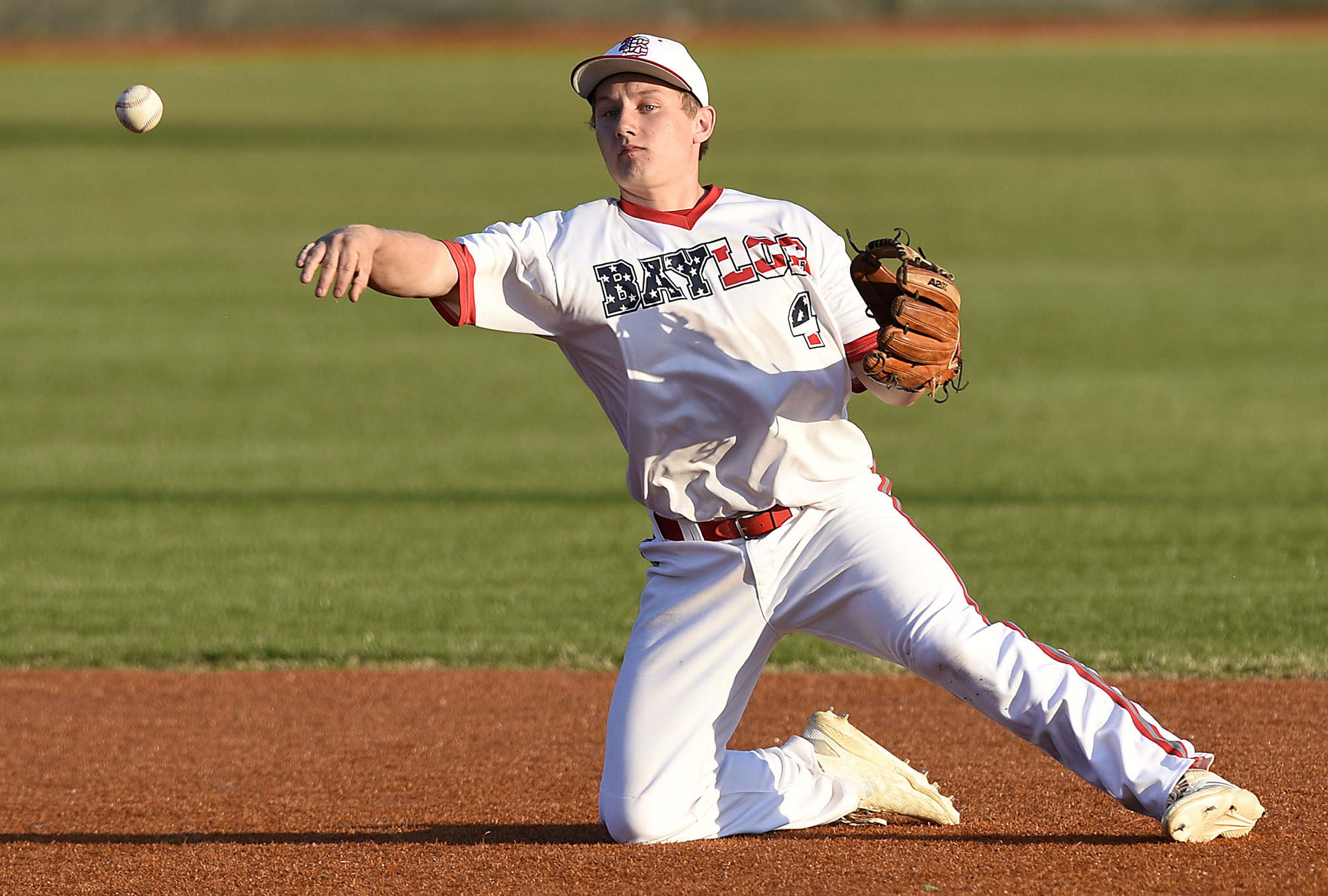 Baylor second baseman Gehrig Ebel (4) comes up with ball and throws a McCallie runner out. The Baylor Red Raiders visited the McCallie Blue Tornado in TSSAA baseball action on March 20, 2019.
