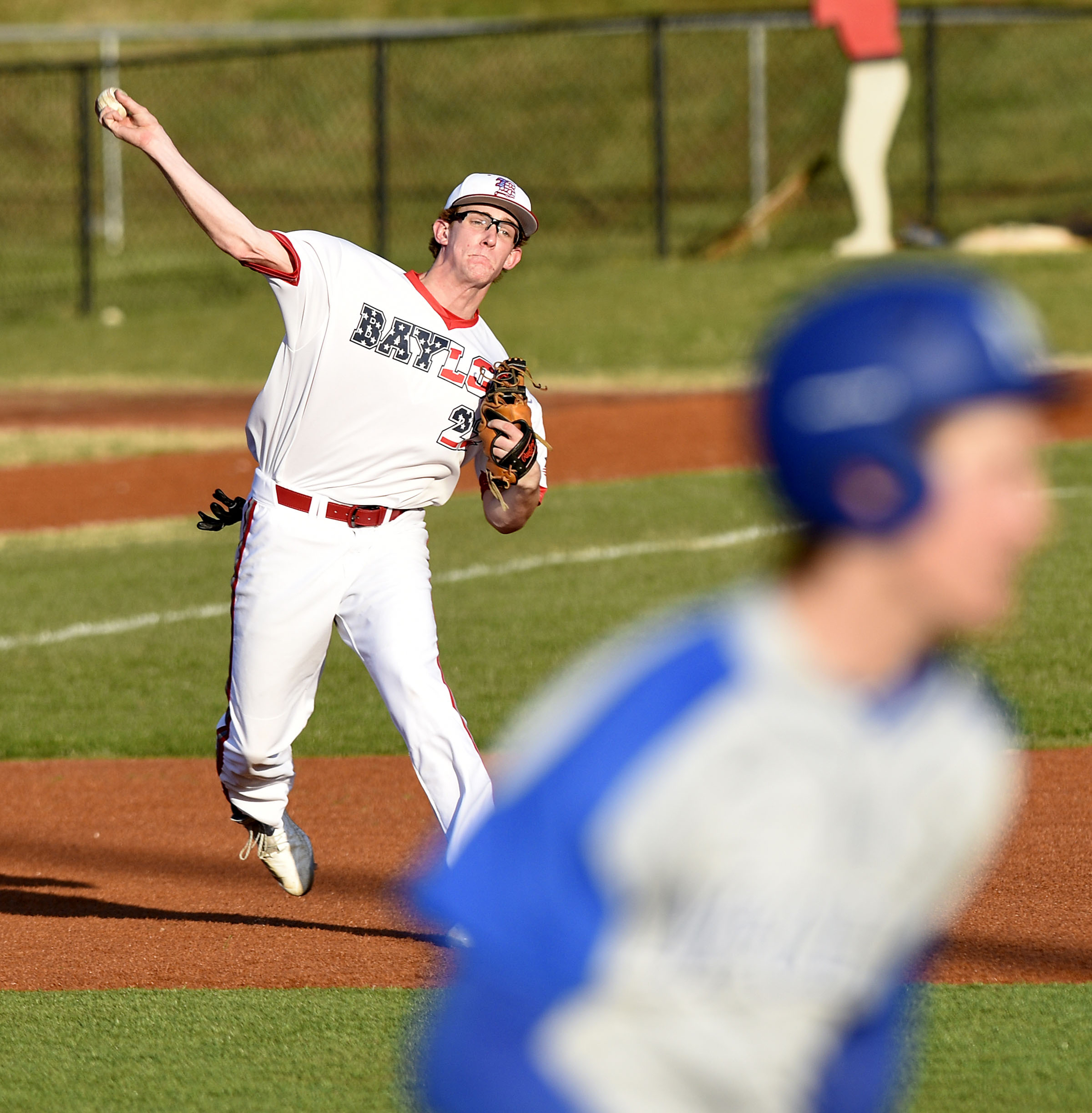 Baylor third baseman Jay Dill (22) throws out a McCallie runner. The Baylor Red Raiders visited the McCallie Blue Tornado in TSSAA baseball action on March 20, 2019.