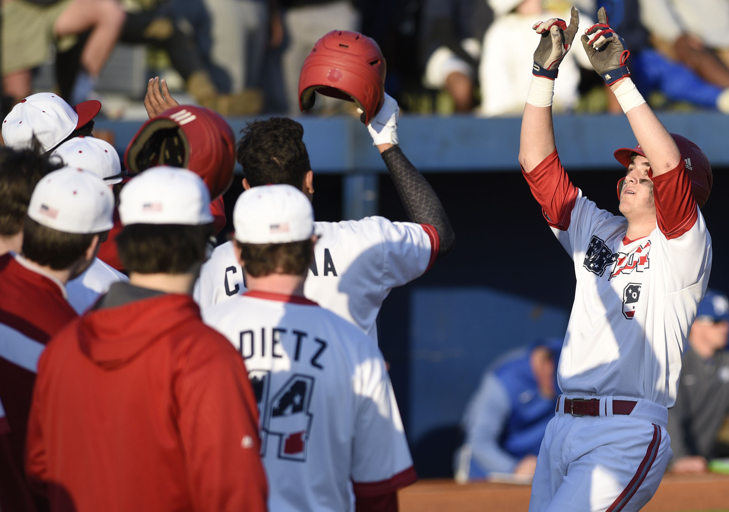 Baylor's Cooper Kinney raises his hands as he crosses the plate after hitting a home run at McCallie on Wednesday.