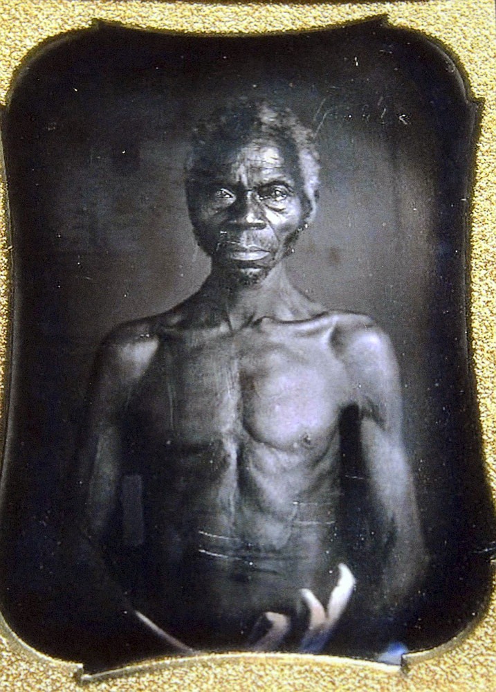 This July 17, 2018 copy photo shows a 1850 Daguerreotype of Renty, a South Carolina slave who Tamara Lanier, of Norwich, Conn., said is her family's patriarch. The portrait was commissioned by Harvard biologist Louis Agassiz, whose ideas were used to support the enslavement of Africans in the United States. Lanier filed a lawsuit on Wednesday, March 20, 2019, in Massachusetts state court, demanding that Harvard turn over the photo and pay damages. (Courtesy of Harvard University/The Norwich Bulletin via AP)

