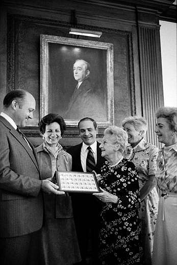 This 1976 photo shows Postmaster General Benjamin F. Bailar presenting the Adolph Ochs stamps to Ochs' daughter, Iphigene Ochs Sulzberger, and her four children, Judith P. Sulzberger, Arthur Ochs Sulzberger, Ruth S. Holmberg, and Marian S. Heiskell.