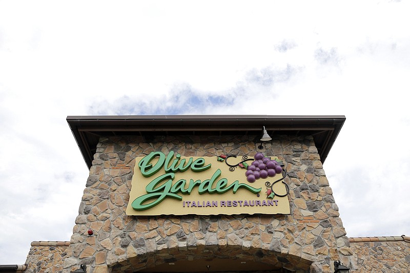 FILE - This June 27, 2016, file photo shows an Olive Garden restaurant in Methuen, Mass. Darden Restaurants Inc. reports earnings Thursday, March 21, 2019. (AP Photo/Elise Amendola, File)