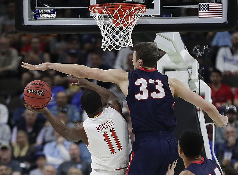 Maryland's Darryl Morsell drives to the basket as Belmont's Nick Muszynski defends during their NCAA tournament game Thursday in Jacksonville, Fla. Maryland won 79-77.