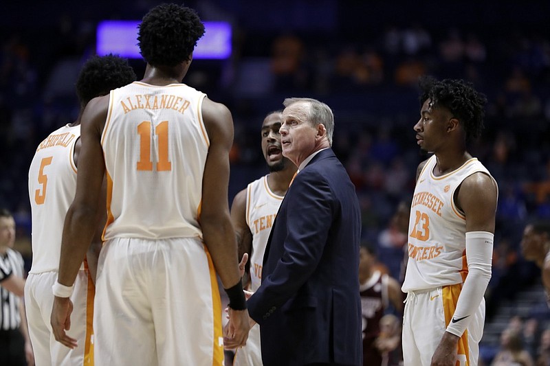 Tennessee men's basketball coach Rick Barnes talks with his players, including Kyle Alexander, during an SEC tournament quarterfinal against Mississippi State last Friday in Nashville. Tennessee won 83-76 and topped Kentucky in the league semifinals before falling to Auburn in the title game. Next up is an NCAA tournament opening-round matchup with Colgate.
