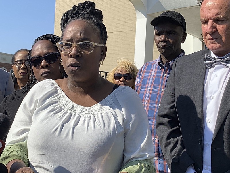 Jeanette McCraney, the wife of the Coley McCraney who is charged with capital murder in the 1999 slayings of two teenage girls, speaks to reporters with attorney David Harrison, outside the Ozark County Courthouse on Wednesday, March 20, 2019 in Ozark, Ala. McCraney said her husband is innocent of the crime. (AP photo/ Kim Chandler) [image2.jpeg]

