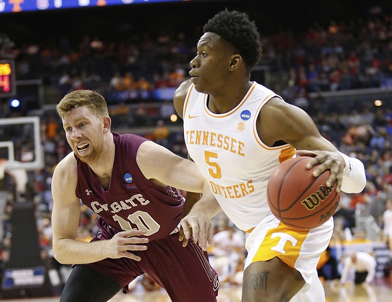 Tennessee's Admiral Schofield drives past Colgate's Will Rayman during an NCAA tournament opening-round game Friday in Columbus, Ohio.