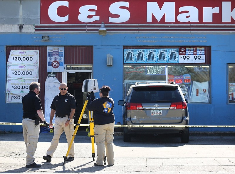 Chattanooga Police Department investigators work the scene of a shooting at the C & S Market on Dodson Avenue Friday, March 22, 2019, in Chattanooga, Tenn. The shooting occurred around 8:30 a.m. Friday morning. Two individuals were shot and taken to local hospitals. / Staff photo by Erin O. Smith