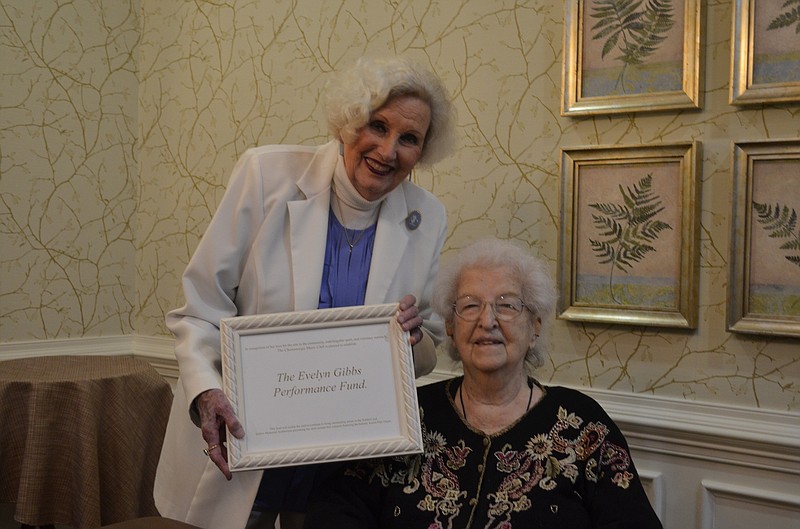 Chattanooga Music Club President Beth Foster Long, left, presents Evelyn Gibbs with a plaque commemorating the establishment of the Evelyn Gibbs Performance Fund during Gibbs' 90th birthday celebration held March 13 at Morning Pointe of Chattanooga at Shallowford. Gibbs died less than a week later. / Staff photo by Emily Crisman