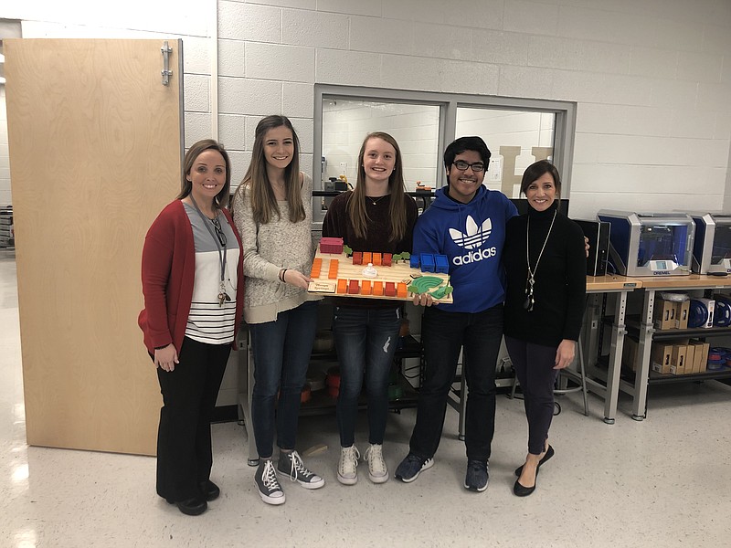 Hixson High School students display the 3-D model of 'Nooga Springs, a concept they developed when asked by the Hixson Chamber Council what they would do to make the Hixson community a more desirable place to live. From left are VW eLab specialist Jill Moses; students Riley Bellamy, Emma Parson and Joseph Franke; and LeAnn Plumlee, VW eLab specialist.