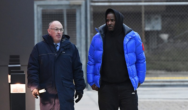 FILE - In this Monday, Feb. 25, 2019 file photo, R. Kelly, right, leaves Cook County Jail with his defense attorney, Steve Greenberg, in Chicago. A strategy seems to be slowly emerging about how R. Kelly and his legal team intend to defend him against charges he sexually abused three girls and an adult woman. (AP Photo/Matt Marton, File)