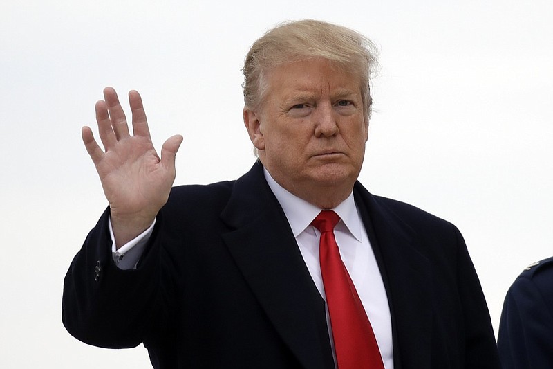 President Donald Trump waves before boarding Air Force One, Friday, March 22, 2019, at Andrews Air Force Base, Md., for a trip to Mar-a-Lago in Palm Beach, Fla. (AP Photo/Carolyn Kaster)