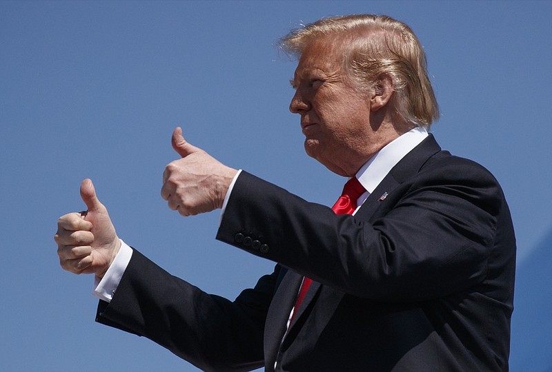 President Donald Trump gives the thumbs-up as he arrives on Air Force One, Friday, March 22, 2019, at Palm Beach International Airport, in West Palm Beach, Fla., en route to Mar-a-Lago in Palm Beach, Fla. (AP Photo/Carolyn Kaster)

