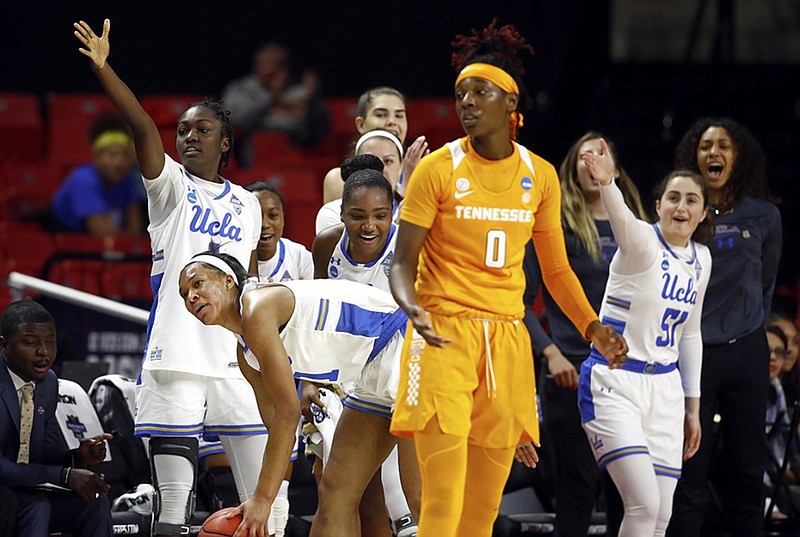 UCLA players celebrate after Tennessee's Rennia Davis was unable to keep the ball in bounds, turning over possession during their NCAA tournament first-round game Saturday in College Park, Md. UCLA won 89-77.