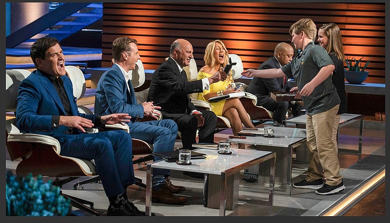 Contributed photo / Tripp Phillips, right, pitches his product Le-Glue on the TV show "Shark Tank." Phillips' business won an $80,000 investment.