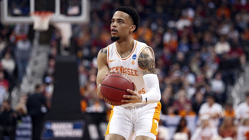 Tennessee guard Lamonte Turner prepares to shoot during the Vols' NCAA tournament opener against Colgate on Friday in Columbus, Ohio. The second-seeded Vols won 77-70 and will take on 10th-seeded Iowa in the second round at 12:10 p.m. Sunday.