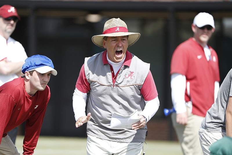 Alabama football coach Nick Saban shouts during Saturday afternoon's practice in Tuscaloosa, which was the fifth spring workout for the Crimson Tide.