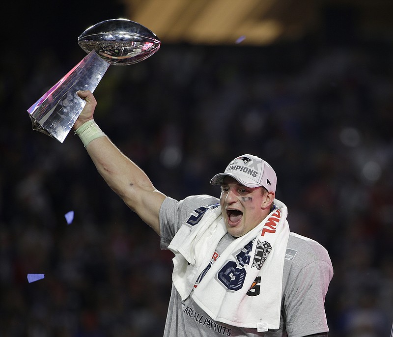 New England tight end Rob Gronkowski celebrates after the Patriots defeated the Seattle Seahawks in the Super Bowl in February 2015 in Glendale, Ariz. Gronkowski announced his retirement in an Instagram post Sunday, ending his NFL career after nine seasons and three championships.
