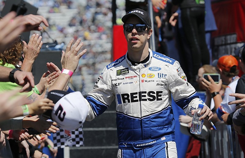 NASCAR driver Brad Keselowski greets fans during drivers' introductions before Sunday's Cup Series race at Martinsville Speedway in Virginia.