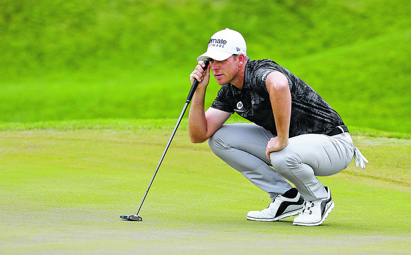 Luke List surveys his putt on the second hold during the third round of The Players Championship golf tournament Saturday, March 16, 2019, in Ponte Vedra Beach, Fla. (AP Photo/Lynne Sladky)