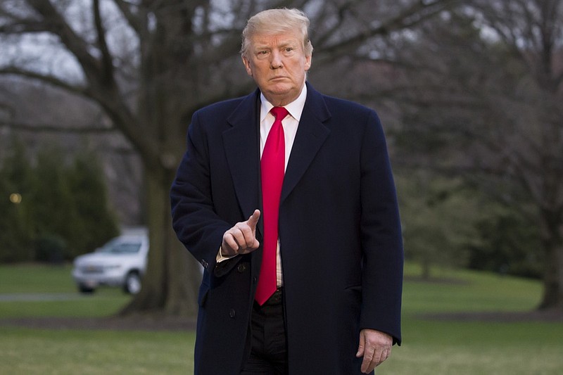 President Donald Trump gestures after stepping off Marine One on the South Lawn of the White House, Sunday, March 24, 2019, in Washington. The Justice Department said Sunday that special counsel Robert Mueller's investigation did not find evidence that President Donald Trump's campaign "conspired or coordinated" with Russia to influence the 2016 presidential election. (AP Photo/Alex Brandon)