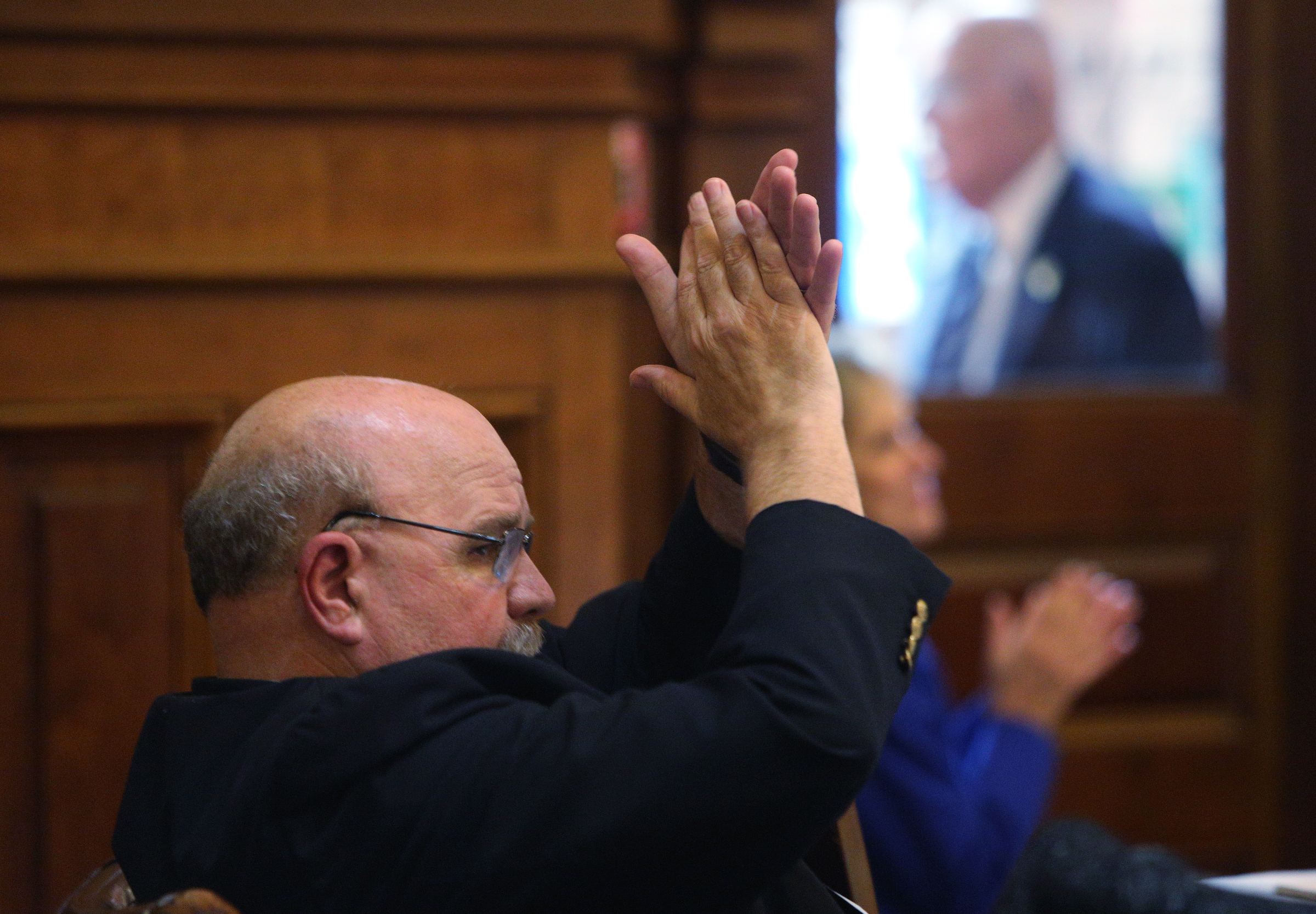 Staff photo by Erin O. Smith / State Rep. Steve Tarvin, R-Ringgold, claps as another state representative thanks his wife for her support Thursday, March 29, 2018 in the House of Representatives at the Georgia State Capitol in Atlanta, Ga. Thursday was the final day in session.