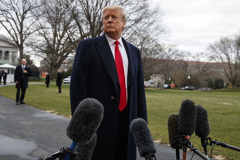 President Donald Trump listens to a question as he speaks with reporters before boarding Marine One on the South Lawn of the White House, Friday, March 22, 2019, in Washington. (AP Photo/Evan Vucci)