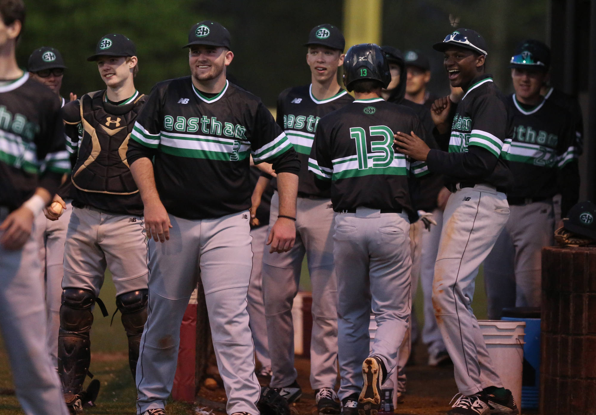 East Hamilton celebrates after teammate Josh Brown (13) scores Tuesday, March 26, 2019 during the East Hamilton vs. Ooltewah baseball game at Ooltewah High School.