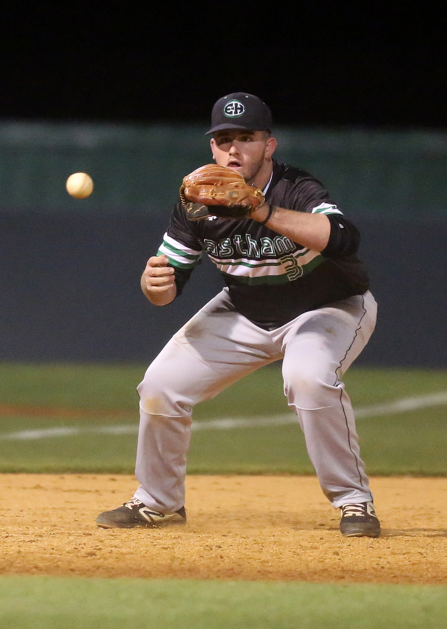 East Hamilton third baseman Noah Pridmore (3) catches a ball on the bounce before getting the out at first Tuesday, March 26, 2019 during the East Hamilton vs. Ooltewah baseball game at Ooltewah High School in Ooltewah, Tennessee.