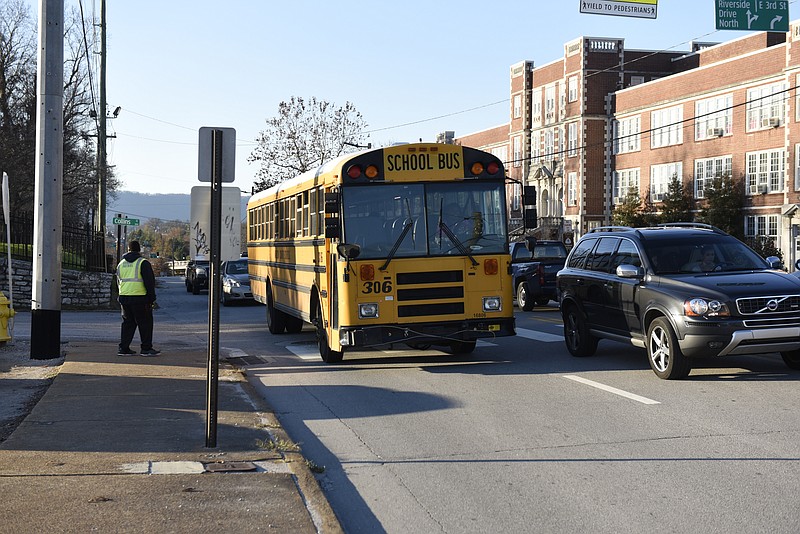 A school bus passes the Chattanooga School for the Arts and Sciences on Monday, Dec. 7, 2015, in Chattanooga, Tenn.