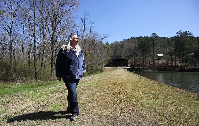 Melissa Tinney shows off the Pigeon Mountain Crossing property she and her husband purchased to make into a retreat several years ago Wednesday, March 27, 2019 in LaFayette, Georgia. Tinney says churches will move their retreats to Tennessee, where they don't have to pay extra for sales tax, instead of booking at Pigeon Mountain Crossing.
