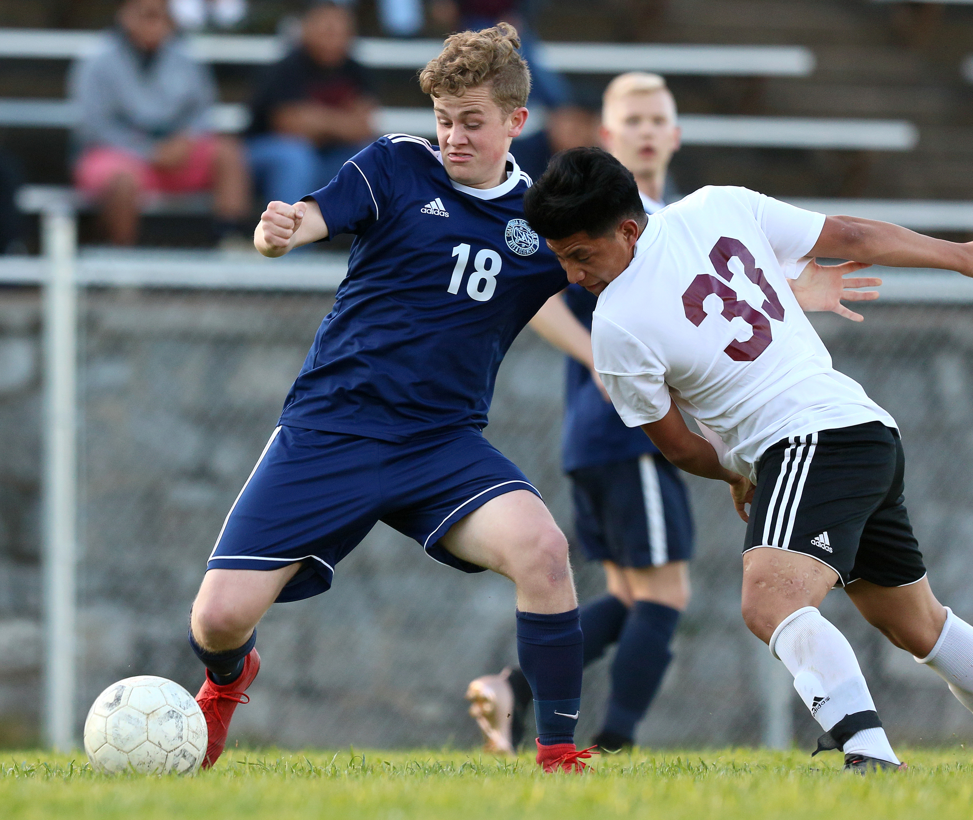 CSAS' Ben Harrison (18) struggles over the ball with Howard's Yefri Baltazar (33) during the Howard vs. CSAS boys' soccer match Wednesday, March 27, 2019 at Chattanooga School for the Arts and Sciences in Chattanooga, Tennessee. CSAS won 2-1.
