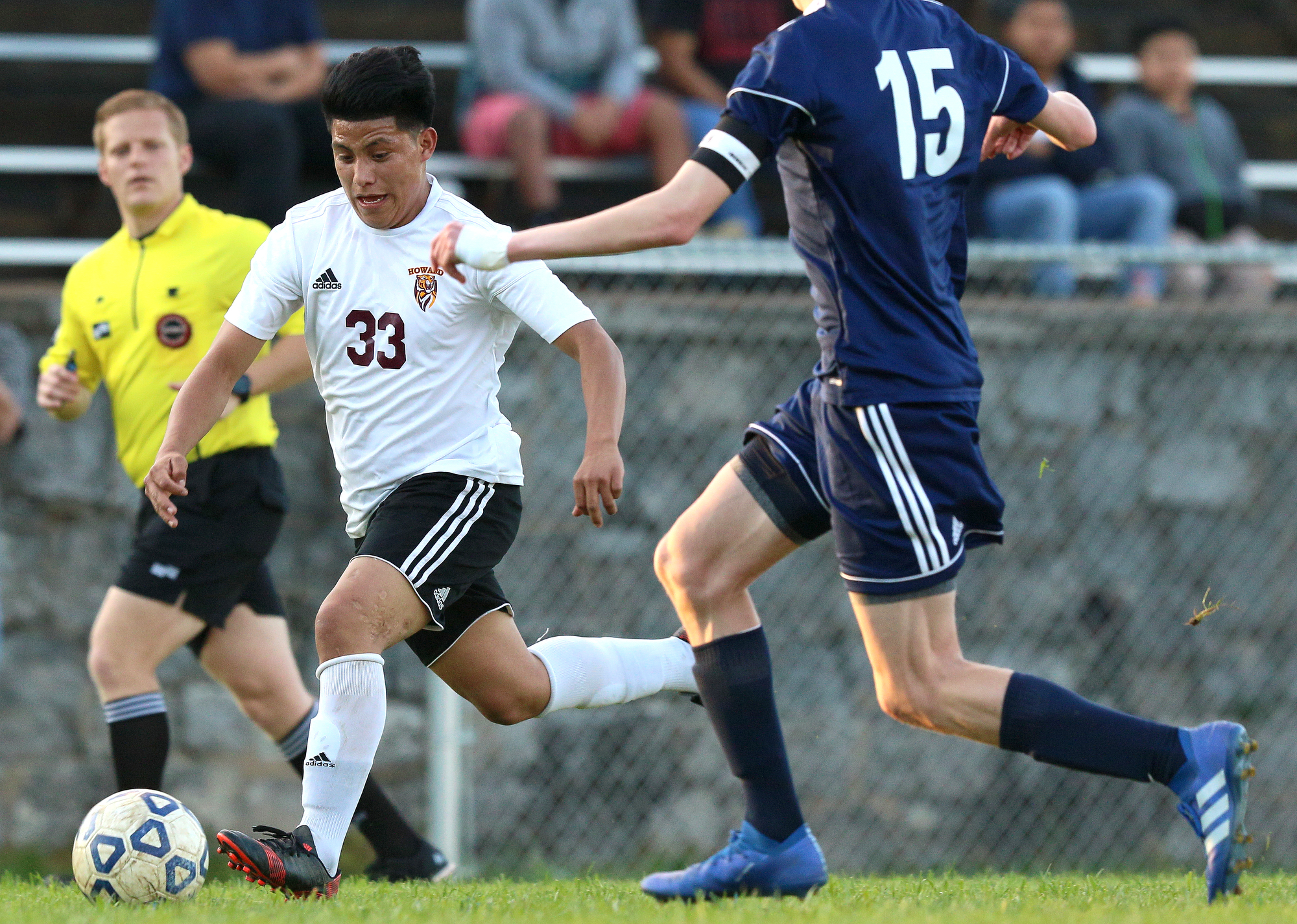 Howard's Yefri Baltazar (33) pushes the ball downfield during the Howard vs. CSAS boys' soccer match Wednesday, March 27, 2019 at Chattanooga School for the Arts and Sciences in Chattanooga, Tennessee. CSAS won 2-1.