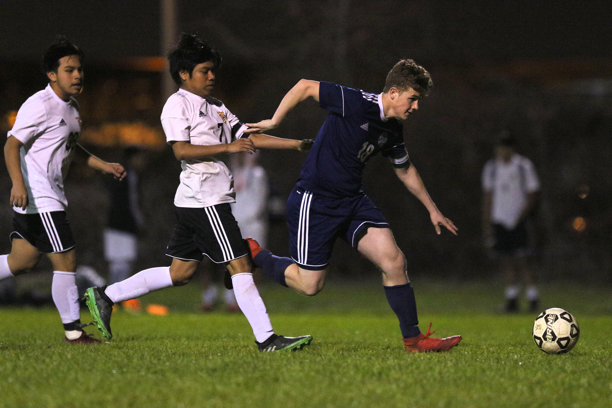 CSAS' Ben Harrison (18) fights off Howard's Cristian Garcia (7) as he pushes the ball downfield during the Howard vs. CSAS boys' soccer match Wednesday, March 27, 2019 at Chattanooga School for the Arts and Sciences in Chattanooga, Tennessee. CSAS won 2-1.