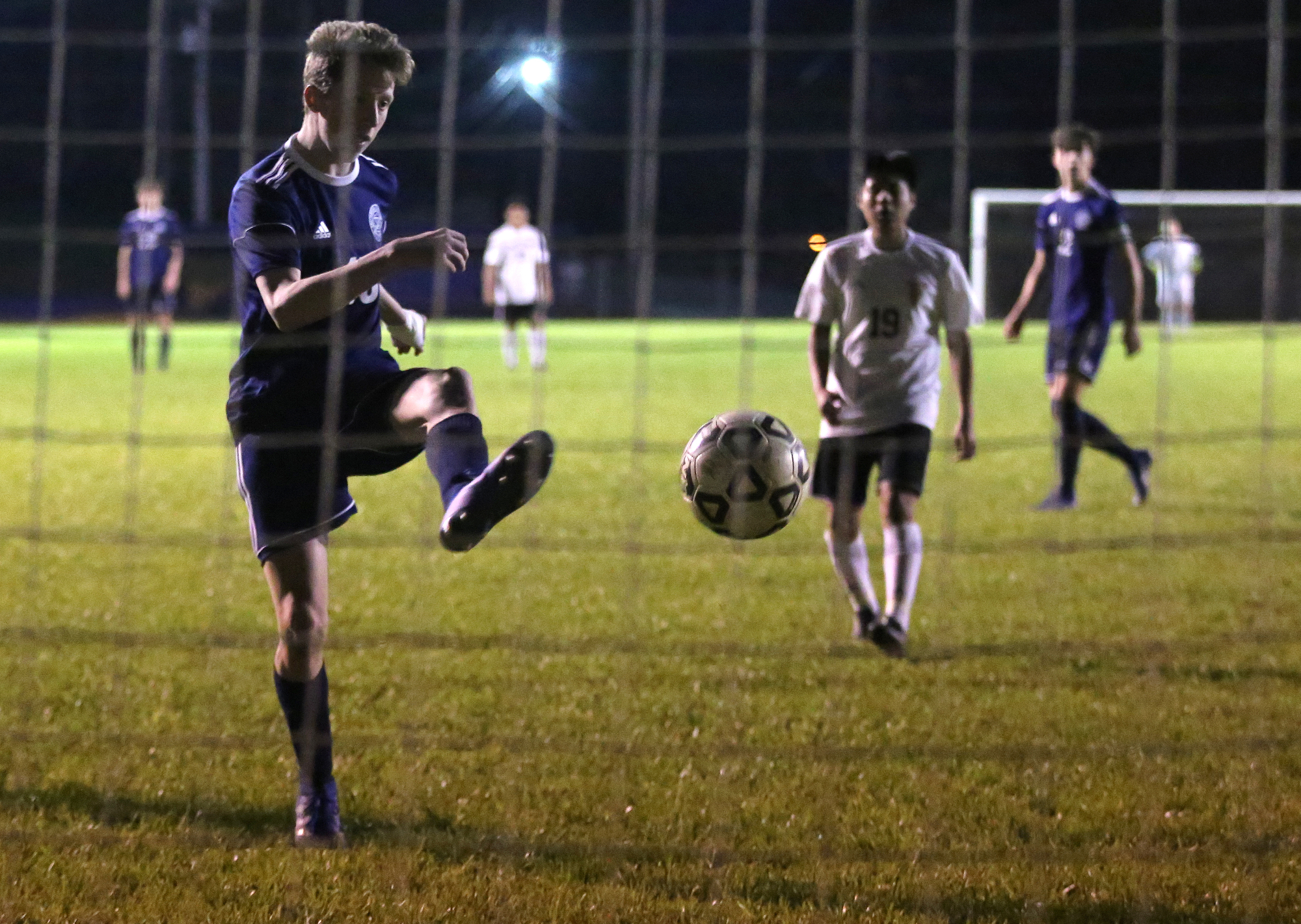 Arts & Sciences' Will Fraser scores the deciding goal in the Patriots' 2-1 home win Wednesday night against Howard.