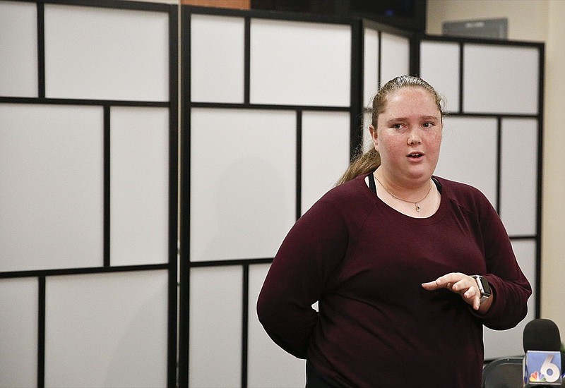 Annabel Claprood, 18, a former Marjory Stoneman Douglas High School student, speaks to the media about the opening of Eagles Haven, a new wellness center created for the MSD community, Wednesday, March 27, 2019, in Coral Springs, Fla. (AP Photo/Brynn Anderson)

