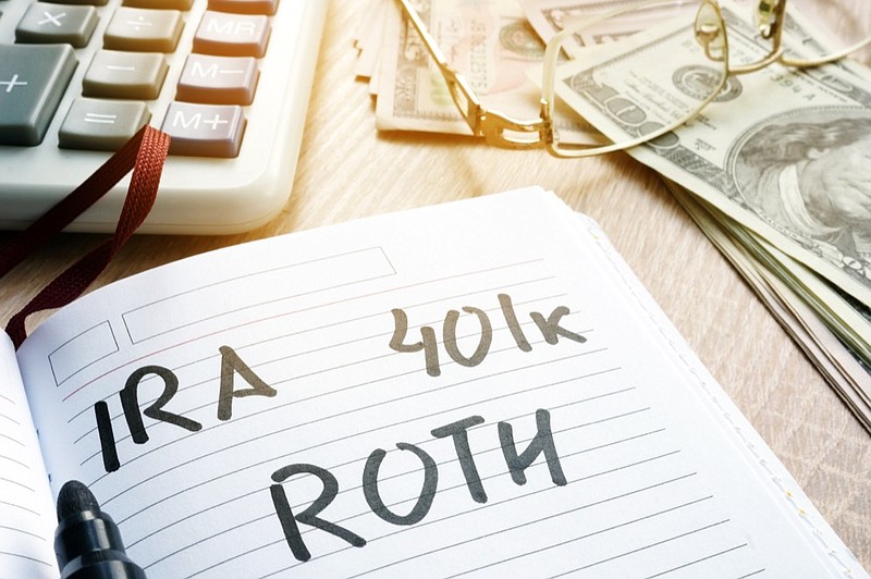  IRA 401k ROTH handwritten in a note. Retirement plans. retirement savings tile retirement tile / Getty Images