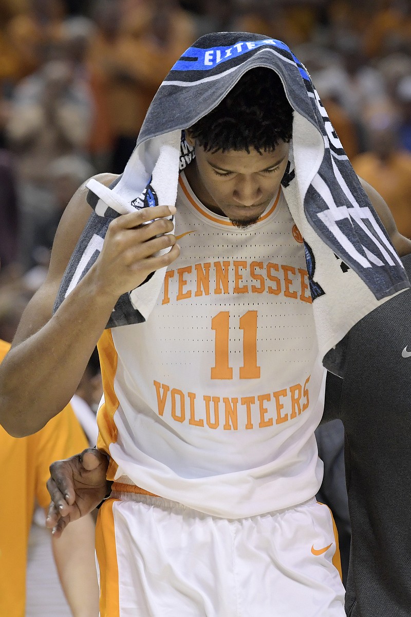 Tennessee senior forward Kyle Alexander leaves the court after the Vols lost to Purdue in overtime in an NCAA tournament South Region semifinal Thursday night in Louisville, Ky. Purdue won 99-94.