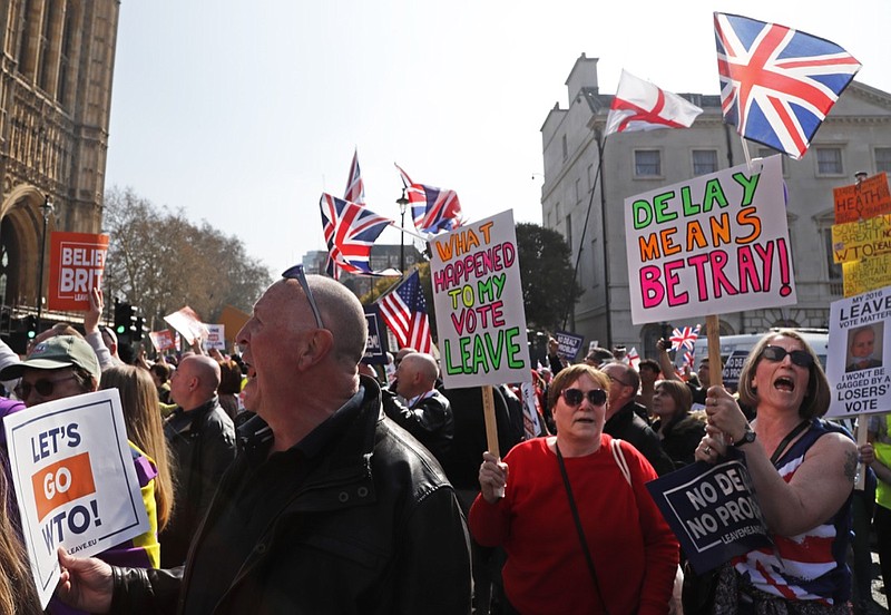 Brexit supporters shout slogans at Parliament Square in Westminster, London, Friday, March 29, 2019. Pro-Brexit demonstrators were gathering in central London on the day that Britain was originally scheduled to leave the European Union. British lawmakers will vote Friday on what Prime Minister Theresa May's government described as the "last chance to vote for Brexit." (AP Photo/ Frank Augstein)