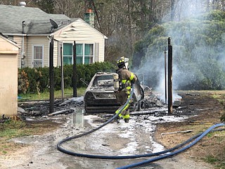 Firefighters work the scene of a vehicle fire on Friday, March 29, 2019, at a home on the 10000 block of Jenkins Circle. / Photo contributed by Amy Maxwell with Hamilton County Emergency Services