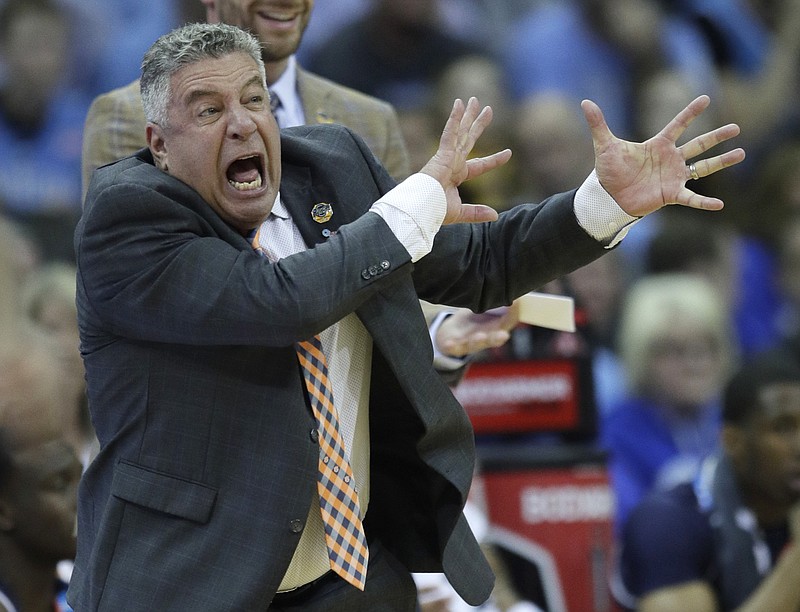 Auburn head coach Bruce Pearl yells from the sidelines during the first half of a men's NCAA tournament college basketball Midwest Regional semifinal game against North Carolina Friday, March 29, 2019, in Kansas City, Mo. (AP Photo/Orlin Wagner)