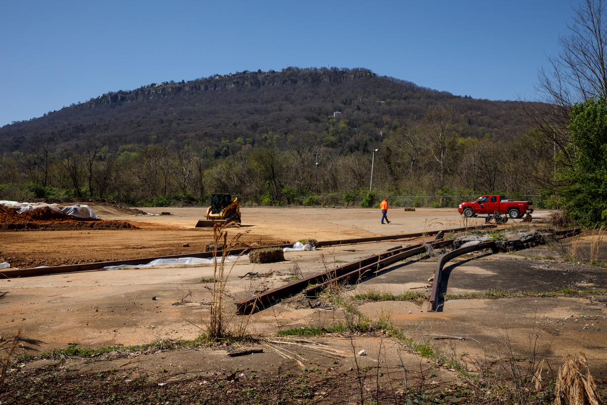 Construction crews remove old rail lines for a connector trail from the Wheeland Foundry Trailhead of the Tennessee Riverwalk to Alton Park on Wednesday, March 27, 2019, in Chattanooga, Tenn. Officials are looking at ways to expand the riverwalk onto the North Shore, into St. Elmo and onto Lookout Mountain.