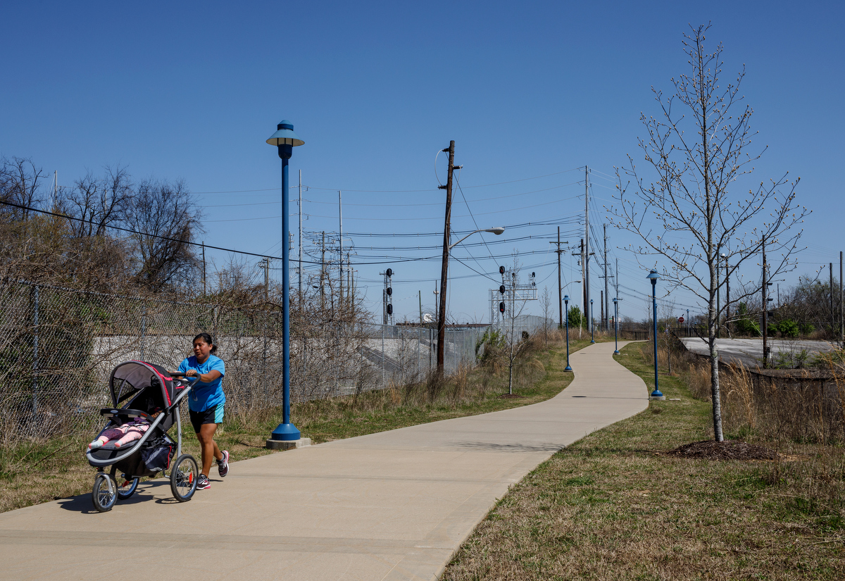 Lilia Gutierrez jogs on the Blue Goose Hollow trail to the Wheeland Foundry Trailhead of the Tennessee Riverwalk on Wednesday, March 27, 2019, in Chattanooga, Tenn. Officials are looking at ways to expand the riverwalk onto the North Shore, into St. Elmo and onto Lookout Mountain.