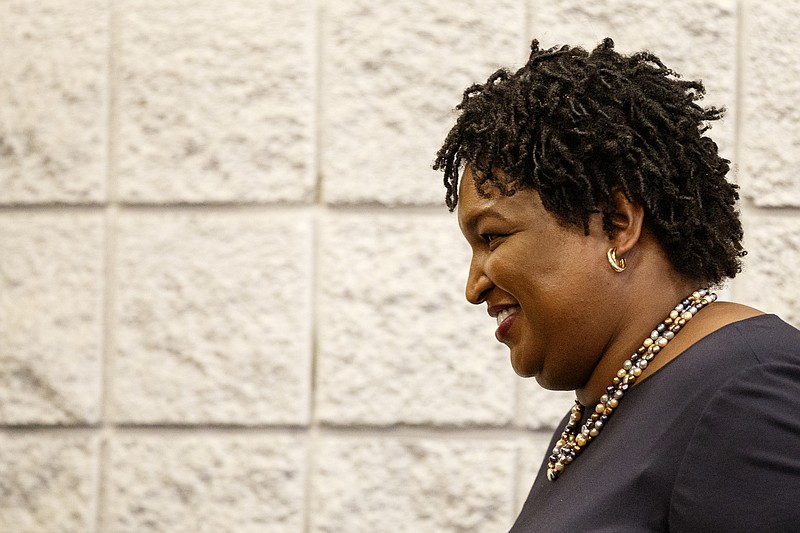 Former Democratic gubernatorial candidate Stacey Abrams leaves the stage after speaking during a stop on her "Thank You Tour" at the Dalton Convention Center on Sunday, March 31, 2019 in Dalton, Ga.
