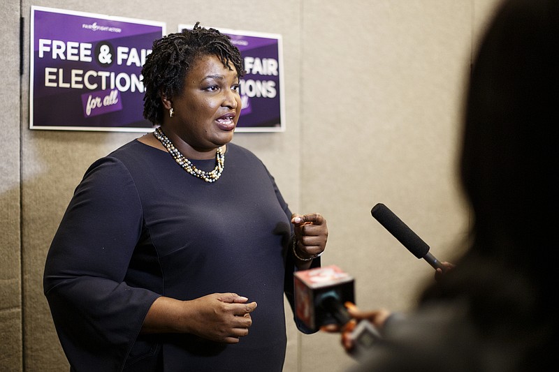 Former Democratic gubernatorial candidate Stacey Abrams meets with the media after speaking during a stop on her "Thank You Tour" at the Dalton Convention Center on Sunday, March 31, 2019 in Dalton, Ga.