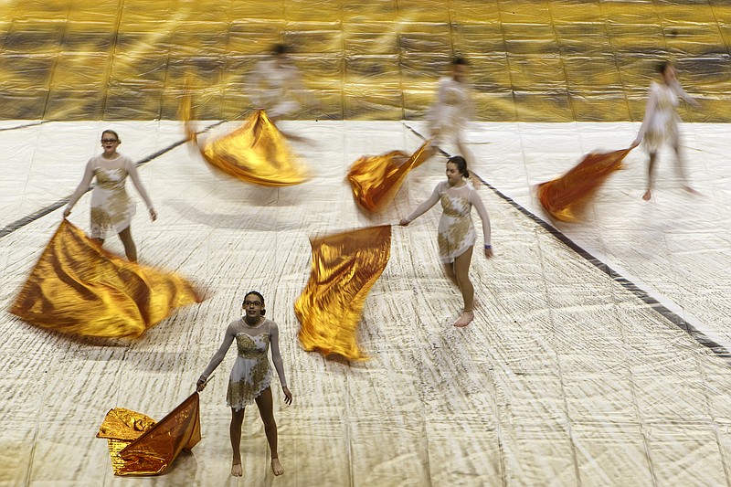 Members of the Soddy-Daisy junior varsity team perform their routine "Fields of Gold" during the Southern Association for Performance Arts Winter Guard Championships at McKenzie Arena on the campus of the University of Tennessee at Chattanooga on Sunday, March 31, 2019 in Chattanooga, Tenn.