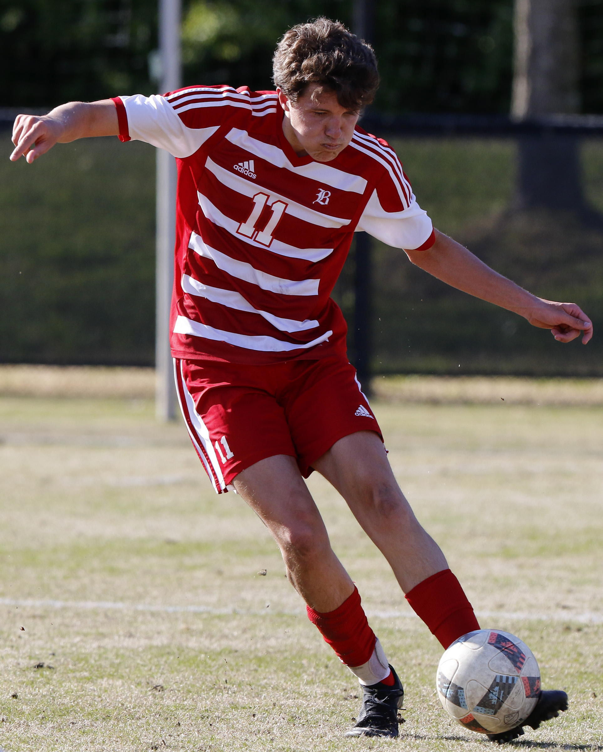 Baylor's Carter Smith (11) kicks the ball against Dalton at Baylor School on Tuesday, April 2, 2019 in Chattanooga, Tenn.